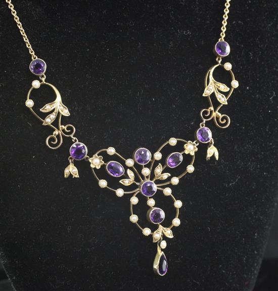 An Edwardian gold, amethyst and seed pearl set drop pendant necklace, 18.5in.